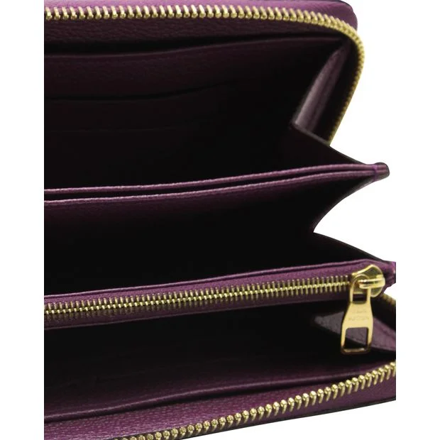 Ladies Louis Vuitton handbags with a detachable coin purse insideLOUIS VUITTON Purple Monogram Embossed Zippy Wallet